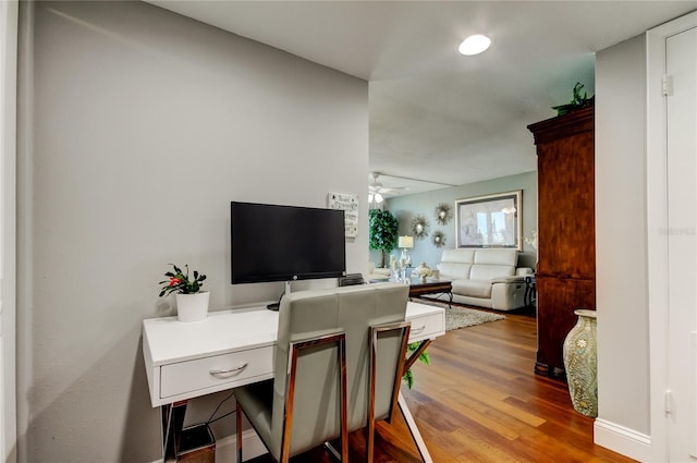 office space featuring ceiling fan and wood finished floors