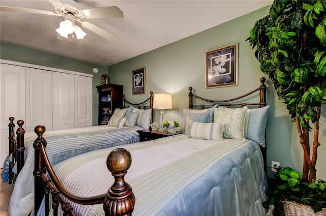 bedroom with ceiling fan and a closet