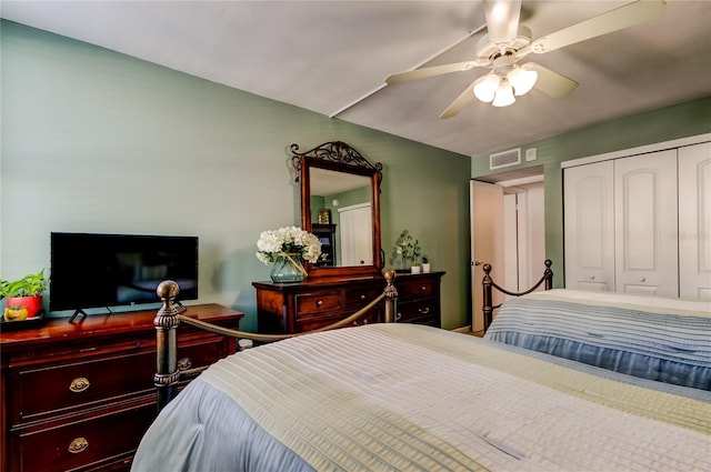 bedroom featuring ceiling fan, a closet, and visible vents