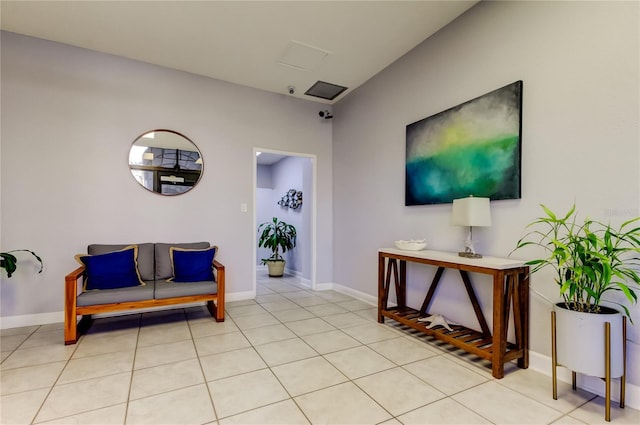 interior space featuring light tile patterned floors and baseboards