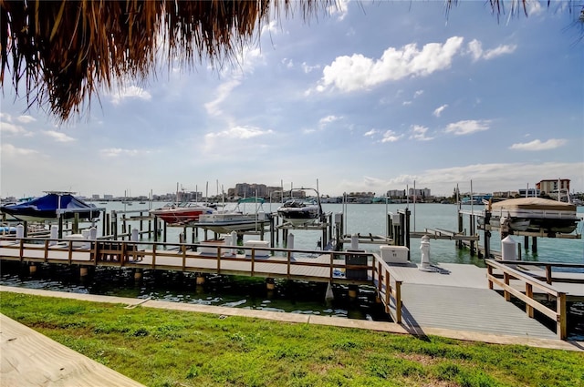 dock area with a water view and boat lift