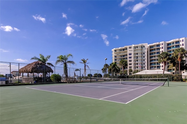 view of sport court with fence