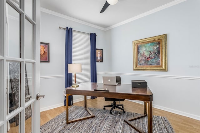 office area with baseboards, ceiling fan, wood finished floors, and crown molding