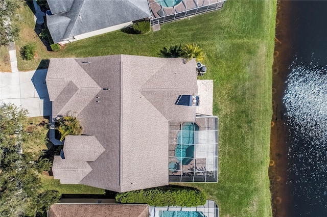 birds eye view of property with a water view