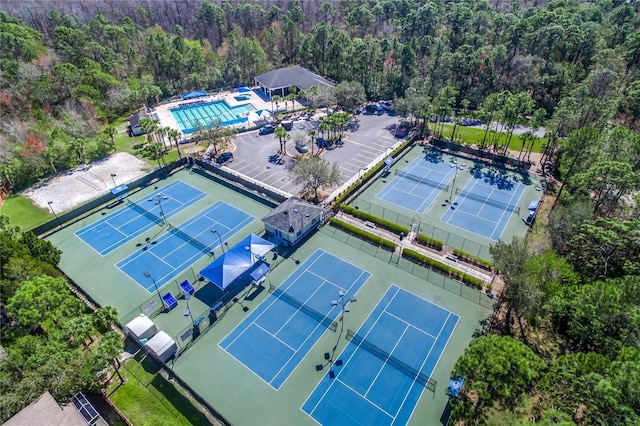 aerial view featuring a wooded view