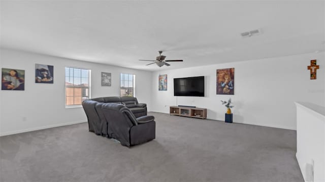 living room featuring a ceiling fan, carpet, visible vents, and baseboards