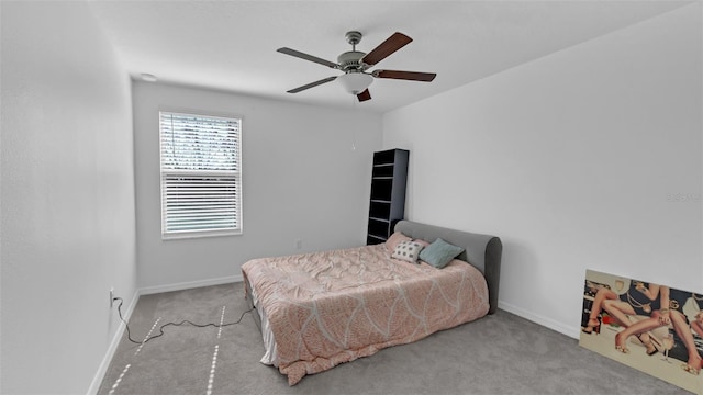 bedroom featuring carpet, a ceiling fan, and baseboards