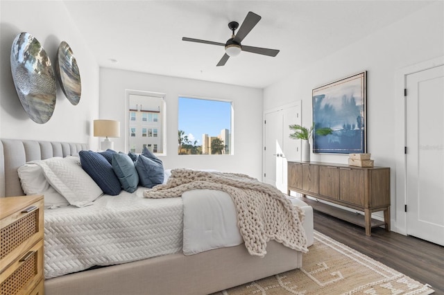 bedroom with ceiling fan and wood finished floors