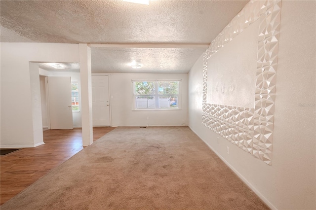1800 27th Ave N, Saint Petersburg, FL 33713 - carpeted empty room with a textured ceiling and baseboards