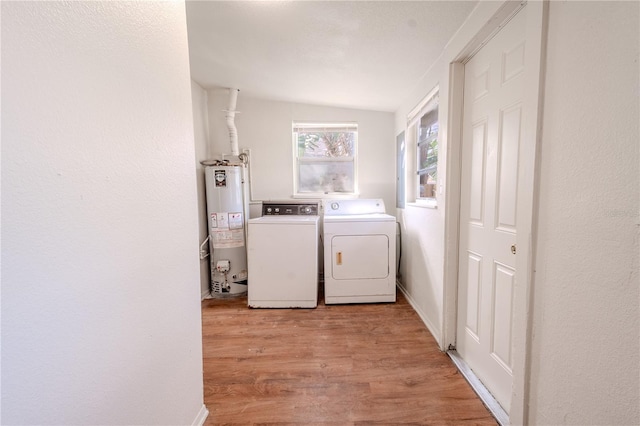 1800 27th Ave N, Saint Petersburg, FL 33713 - laundry area with laundry area, baseboards, light wood-style flooring, independent washer and dryer, and water heater
