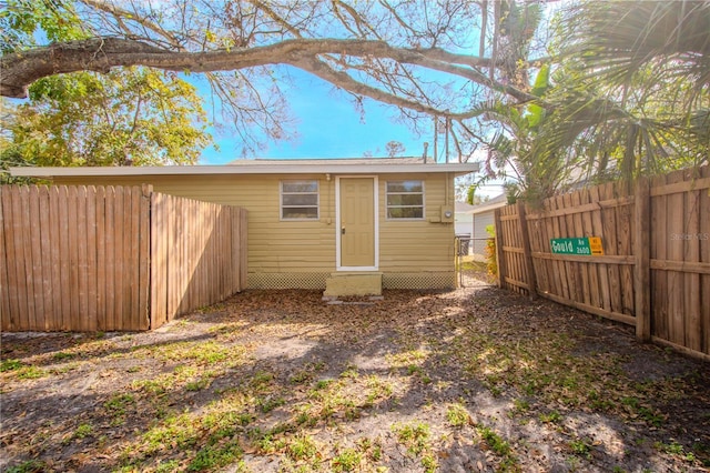 1800 27th Ave N, Saint Petersburg, FL 33713 - rear view of house with an outdoor structure and a fenced backyard