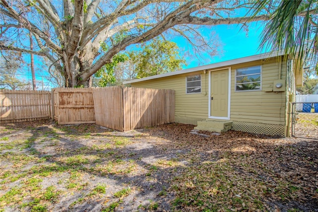 1800 27th Ave N, Saint Petersburg, FL 33713 - rear view of property featuring entry steps and a fenced backyard
