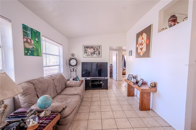 1800 27th Ave N, Saint Petersburg, FL 33713 - living room featuring light tile patterned flooring and vaulted ceiling