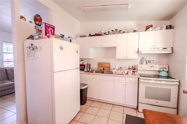 1800 27th Ave N, Saint Petersburg, FL 33713 - kitchen featuring white appliances, light tile patterned floors, under cabinet range hood, white cabinetry, and a sink