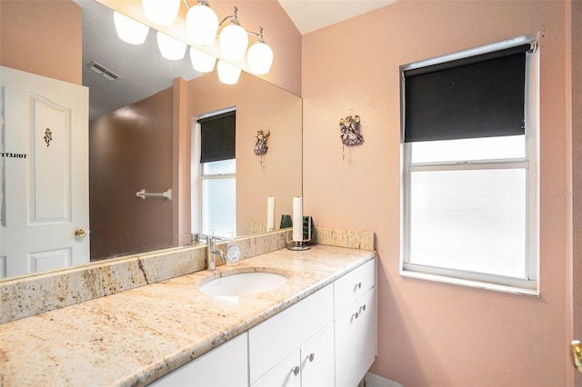 bathroom with visible vents and vanity