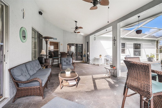 interior space featuring a ceiling fan, a lanai, and an outdoor living space