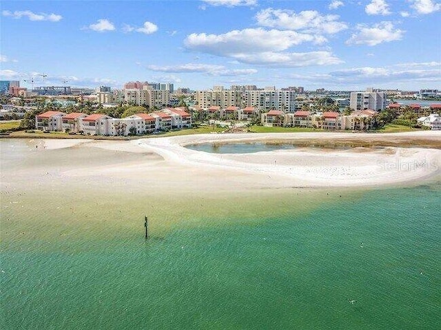 birds eye view of property with a city view and a water view