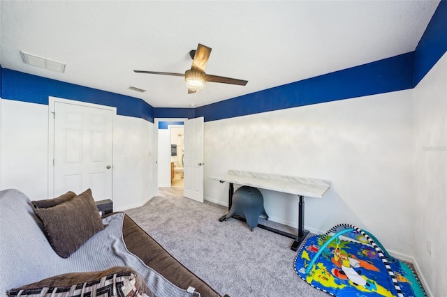 carpeted bedroom featuring baseboards, visible vents, and ceiling fan