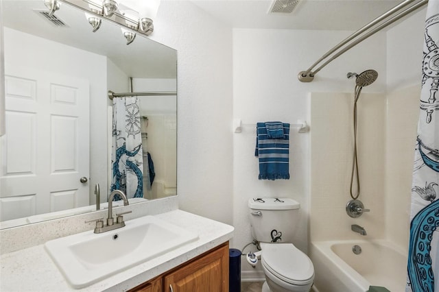 bathroom with toilet, shower / tub combo, visible vents, and vanity