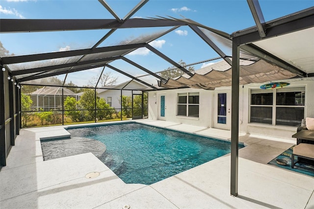 pool with a lanai and a patio