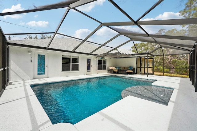 outdoor pool with a patio area, a lanai, and an outdoor living space