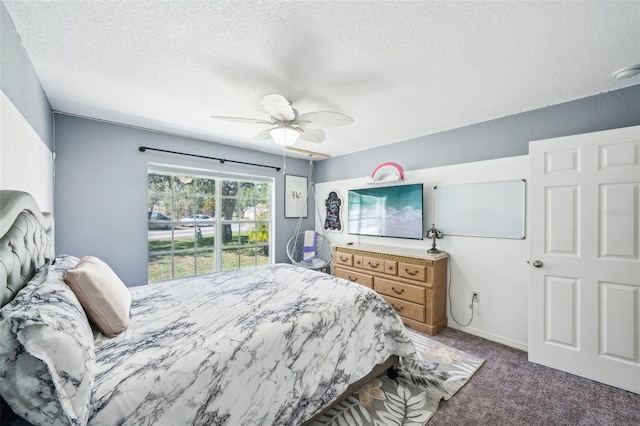 carpeted bedroom with a textured ceiling and ceiling fan