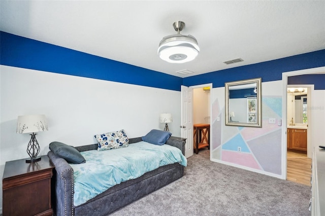 bedroom featuring carpet floors, visible vents, and baseboards