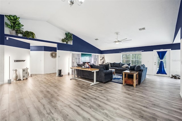 13 Witch Hazel Ct, Homosassa, FL 34446 - living room with wood finished floors, ceiling fan, high vaulted ceiling, a chandelier, and baseboards