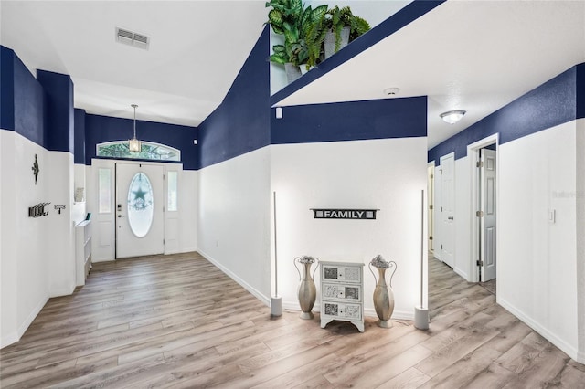 13 Witch Hazel Ct, Homosassa, FL 34446 - entryway featuring wood finished floors, a towering ceiling, and baseboards