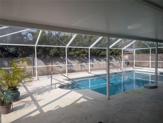 view of pool featuring a lanai, a patio area, a fenced backyard, and a fenced in pool