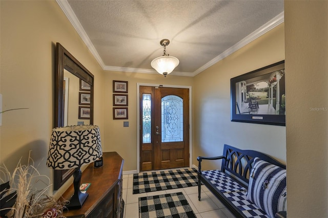 entryway with ornamental molding, light tile patterned flooring, a textured ceiling, and baseboards