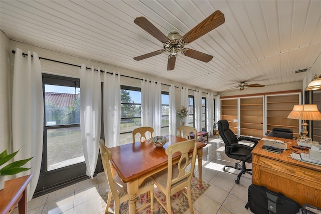 sunroom / solarium featuring wooden ceiling and visible vents