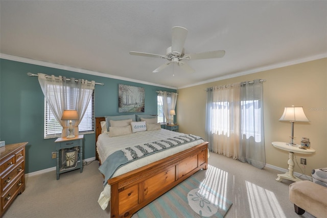 bedroom with crown molding, baseboards, and light colored carpet