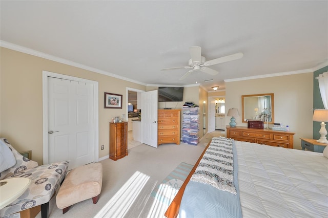 bedroom featuring light carpet, ornamental molding, a ceiling fan, and ensuite bathroom