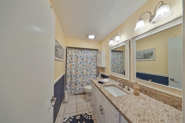 full bathroom featuring vanity, tile patterned flooring, toilet, and a shower with curtain