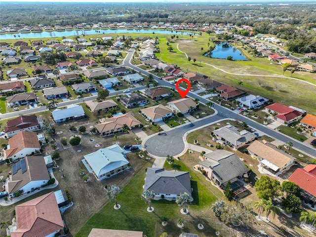 bird's eye view with a water view and a residential view