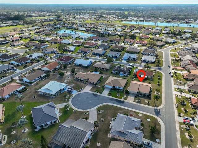 birds eye view of property featuring a residential view and a water view