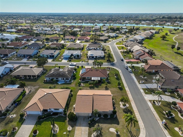 bird's eye view featuring a water view and a residential view