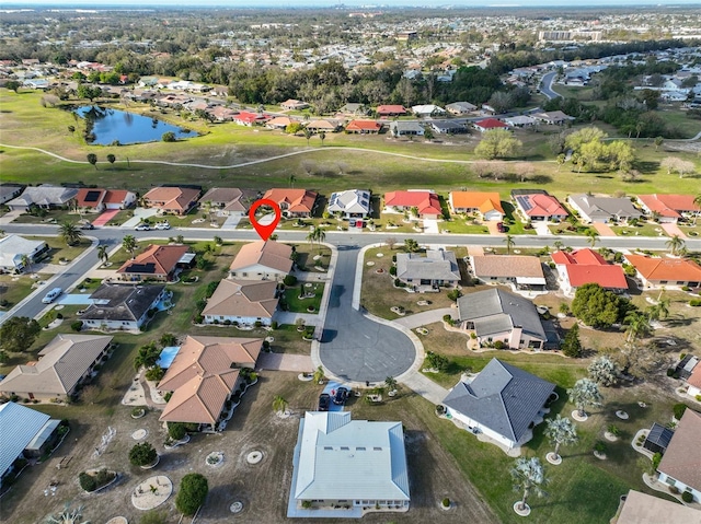 aerial view with a water view and a residential view