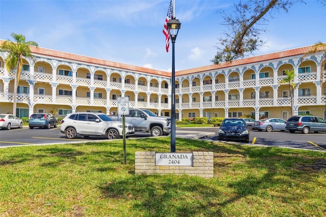 view of property with uncovered parking