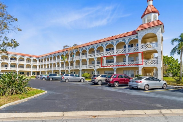 view of property with uncovered parking