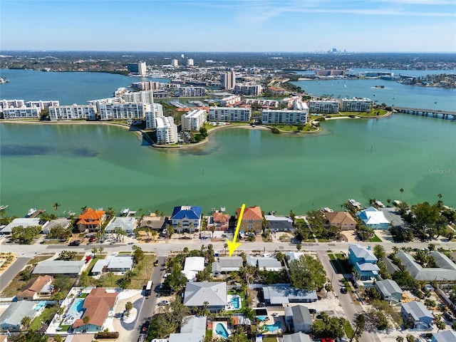 drone / aerial view featuring a water view and a city view