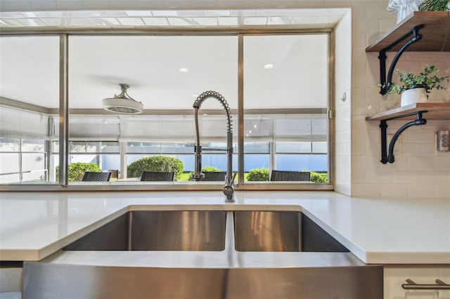 room details featuring light countertops and a sink