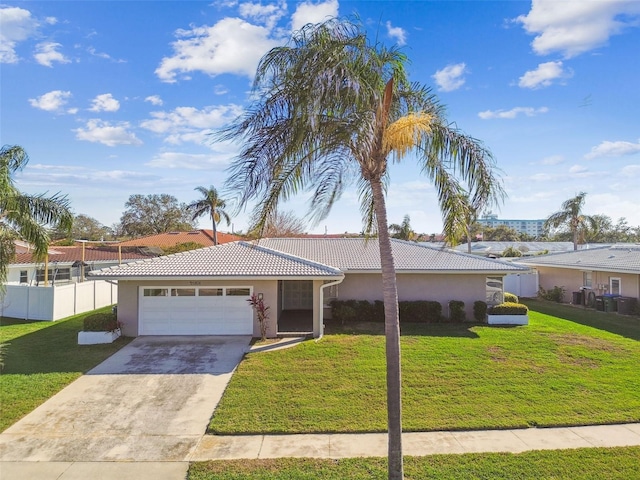 ranch-style house featuring stucco siding, a garage, driveway, a tiled roof, and a front lawn