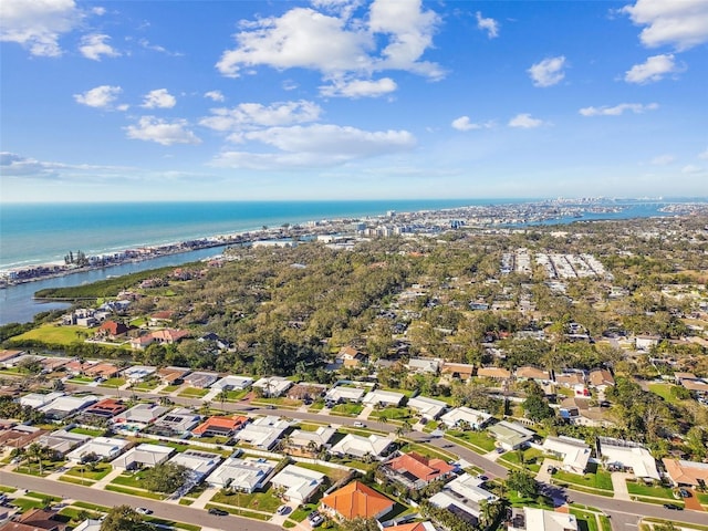 drone / aerial view with a water view and a residential view