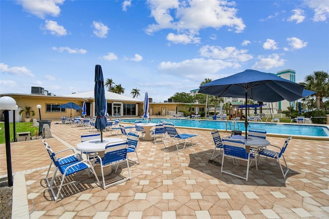 community pool featuring a patio area