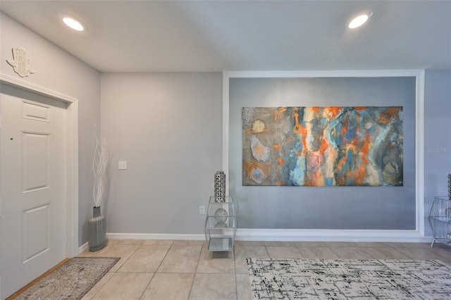 entrance foyer featuring light tile patterned floors, recessed lighting, and baseboards