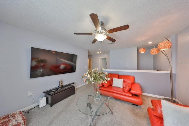 living room with carpet, visible vents, and baseboards