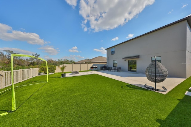 view of yard with a fenced backyard and a patio