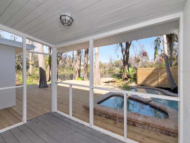 unfurnished sunroom with wooden ceiling and a wealth of natural light